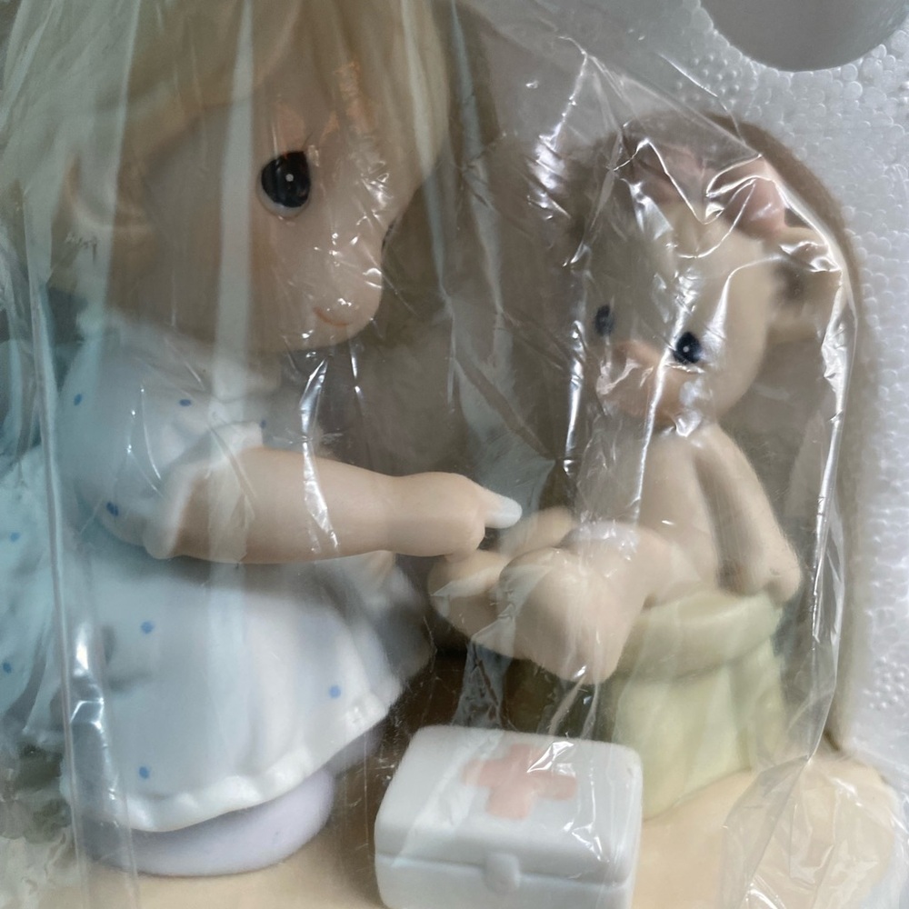 Precious moments caring figurine. Nurse. 1994 like new in box.